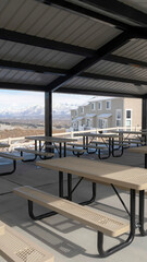 Vertical Pavilion at a park in South Jordan City Utah overlooking snowy Wasatch Mountains