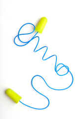 Modern green ear plugs on a white background. lace earplugs