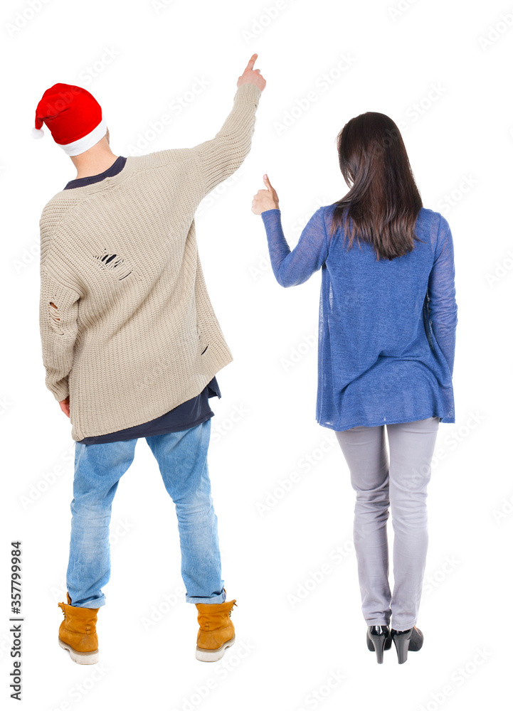 Poster Back view of couple in sweater pointing.