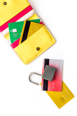 credit card hacked. open lock, wallet on white table top-down