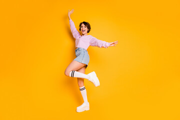 Fototapeta na wymiar Full length body size view of her she nice attractive lovely pretty glad positive slender cheerful cheery girl dancing having fun time isolated on bright vivid shine vibrant yellow color background