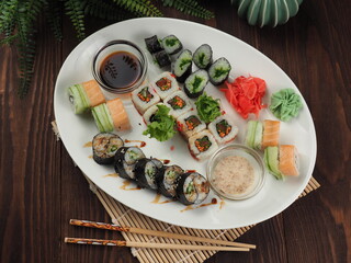 Fresh and tasty sushi on the wooden table