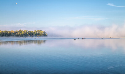 Fresh autumn foggy morning and fishing on the lake