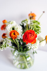 A bouquet of fresh ranunculus on the table.