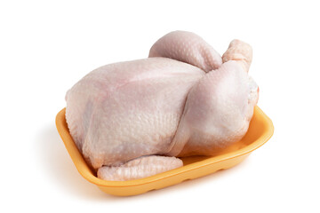 Whole raw chicken carcass on a shopping tray isolated on a white background with clipping paths...