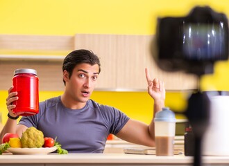 Young man blogging about food supplements