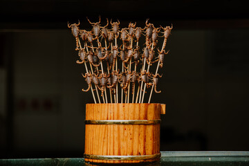 Detail of a feeding stand in beijing with fried scorpions
