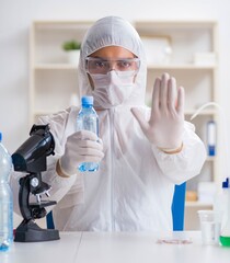 Lab assistant testing water quality