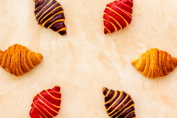 Frame of croissants - fresh bakery on stone background. Top view