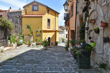 Fototapeta na wymiar A narrow street between the houses of the medieval town of Eboli in the province of Salerno, Italy.