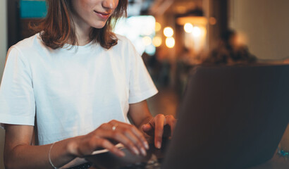  female manager using laptop in cafe, hipster girl freelancer writing on keyboard, businesswoman working via portable computer, student online learning  .through internet technology