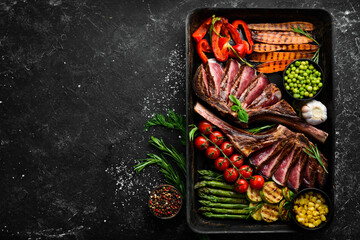 Grilled beef steak with grilled vegetables: asparagus, corn, zucchini, carrots and rosemary....