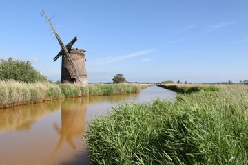 Brograve Mill: an abandoned and dilapidated wind pump on the Norfolk Broads, England, UK.