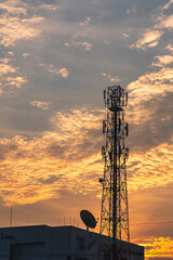 Telecommunication tower Antenna at sunset.