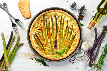 Puff pastry tart with asparagus and spices. Healthy food. Top view. Free space for your text.