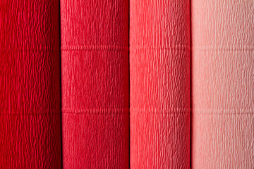 Colorful rolls of crepe paper. Red gamut.
