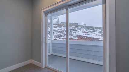 Fototapeta na wymiar Panorama View through glass doors of winter snow