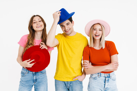 Image Of Funny Caucasian Man And Women In Hats Making Fun On Camera