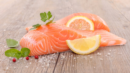 raw salmon fillet with lemon and salt