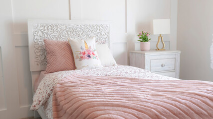 Panorama frame Bedroom interior with floral feminine beddings and decorative headboard on bed