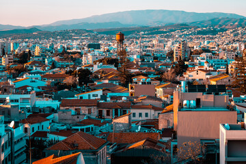Elevated view above the Limassol Old Town with Water tower in the middle and Troodos mountains on background. Cyprus