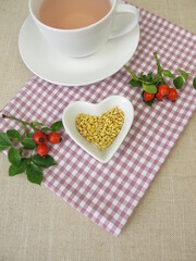 Obraz premium A cup of kernels tea from rose hip seeds