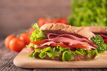 sandwich with ham, tomato and lettuce