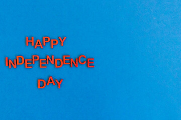 Wooden letters in red. Happy independence day