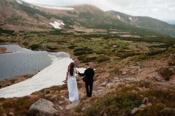 Fototapeta na wymiar Wedding couples photoshoot in beautiful carpathian mountains