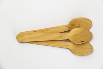 Three Wooden Spoons on a white background. Environmentally Friendly Cutlery Alternative to Plastic.