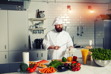 Portrait of mature chef in uniform prepare his kitchen 