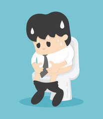 business man sitting on the toilet with his stomach ache and possibly a bowel disease
