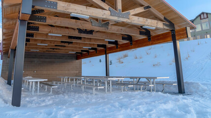 Panorama frame Wooden pavilion attached to a building at a neighborhood in Wasatch Mountain