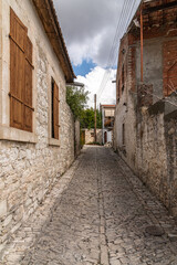 Narrow street in tourist ancient village of Lania, Cyprus