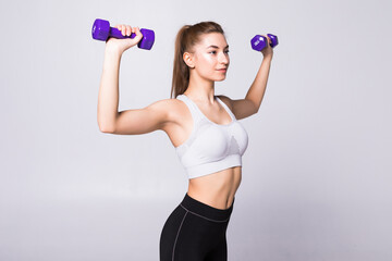 Healthy woman with dumbbells working out isolated on white background. Fitness gym concept