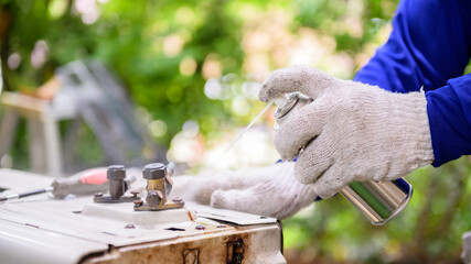 Asian man online learning and repair air conditioner at home. Social distancing and New normal...
