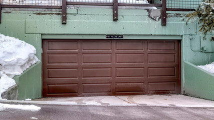 Panorama Garage entrance of a residential building complex with Low Clearance sign