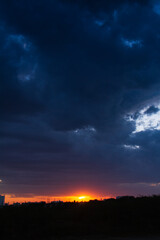 wide blue dark clouds orange sun set design