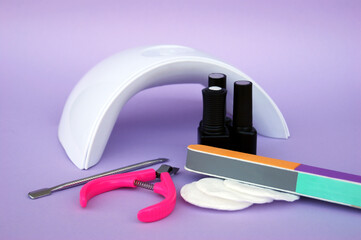 Set for manicure. Lamp for nails. Master of nail service.