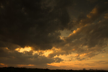 Evening sunset sky with rain dark clouds