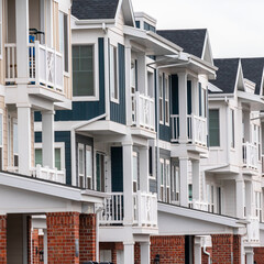 Square Row of new built American houses day light