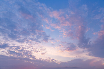 Blue sky with pink clouds. Summer sunset.