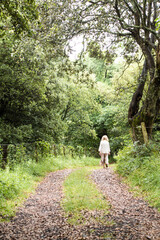 Fototapeta na wymiar Woman walk in the forest