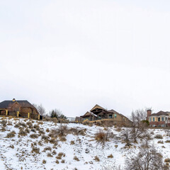 Square frame Beautiful houses on a snow dusted mountain in Salt Lake City viewed in winter