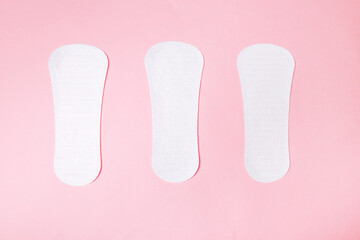 sanitary napkin on pink background, health care, monthly protection, reliable friend.