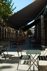 Empty cafe with a terrace on the streets of the old district tourist city. City of Porto without tourists. Summer 2020 