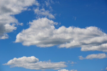 Air clouds in the blue sky. Nature background