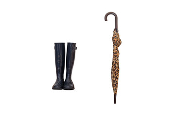 black rubber boots and folded leopard umbrella isolated on white background