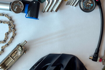 Bicycle accessories and tools with a top view, on a white background.