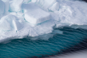Cracks in the melting sea ice North of Spitsbergen.  © Sandra